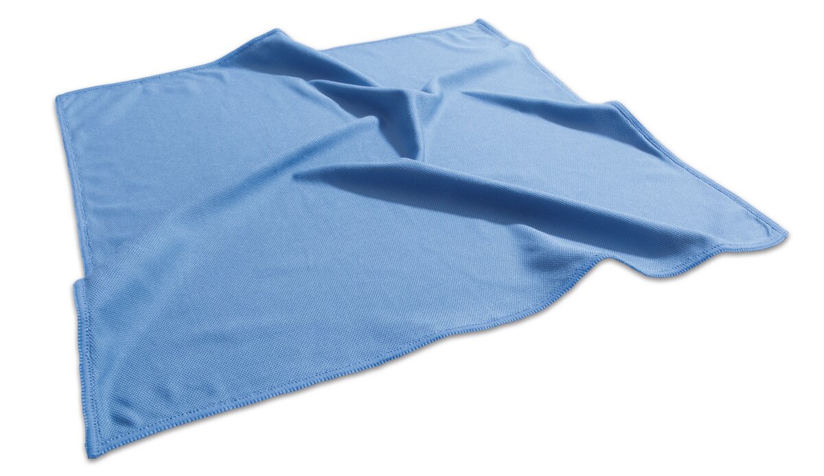 Light blue folded microfiber cloth on white background