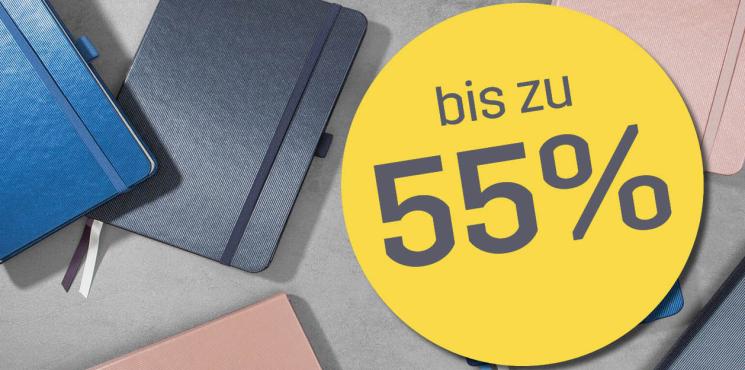 Button mit Messerabatt von bis zu 55%, Conceptum Notizbücher im Hintergrund