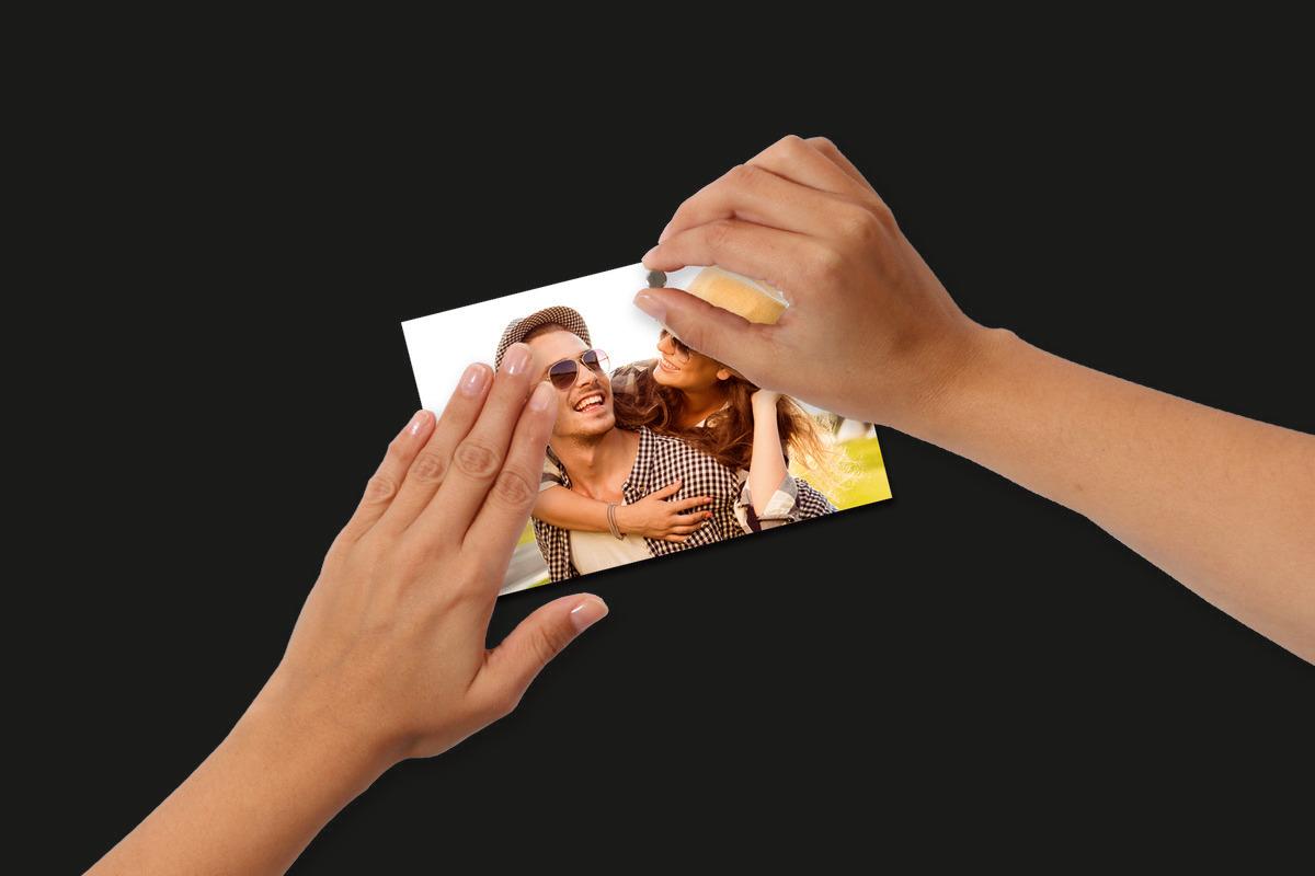 Hands holding a cheerful photo