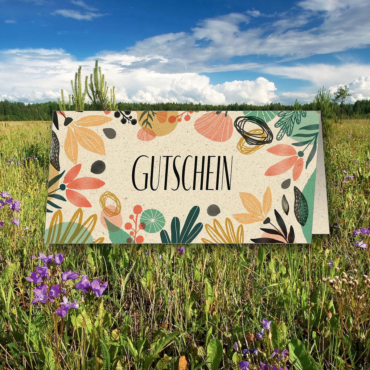 Bunte Gutschein-Karte auf blühender Wiese