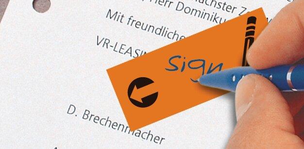 Papier mit handschriftlicher Unterschrift