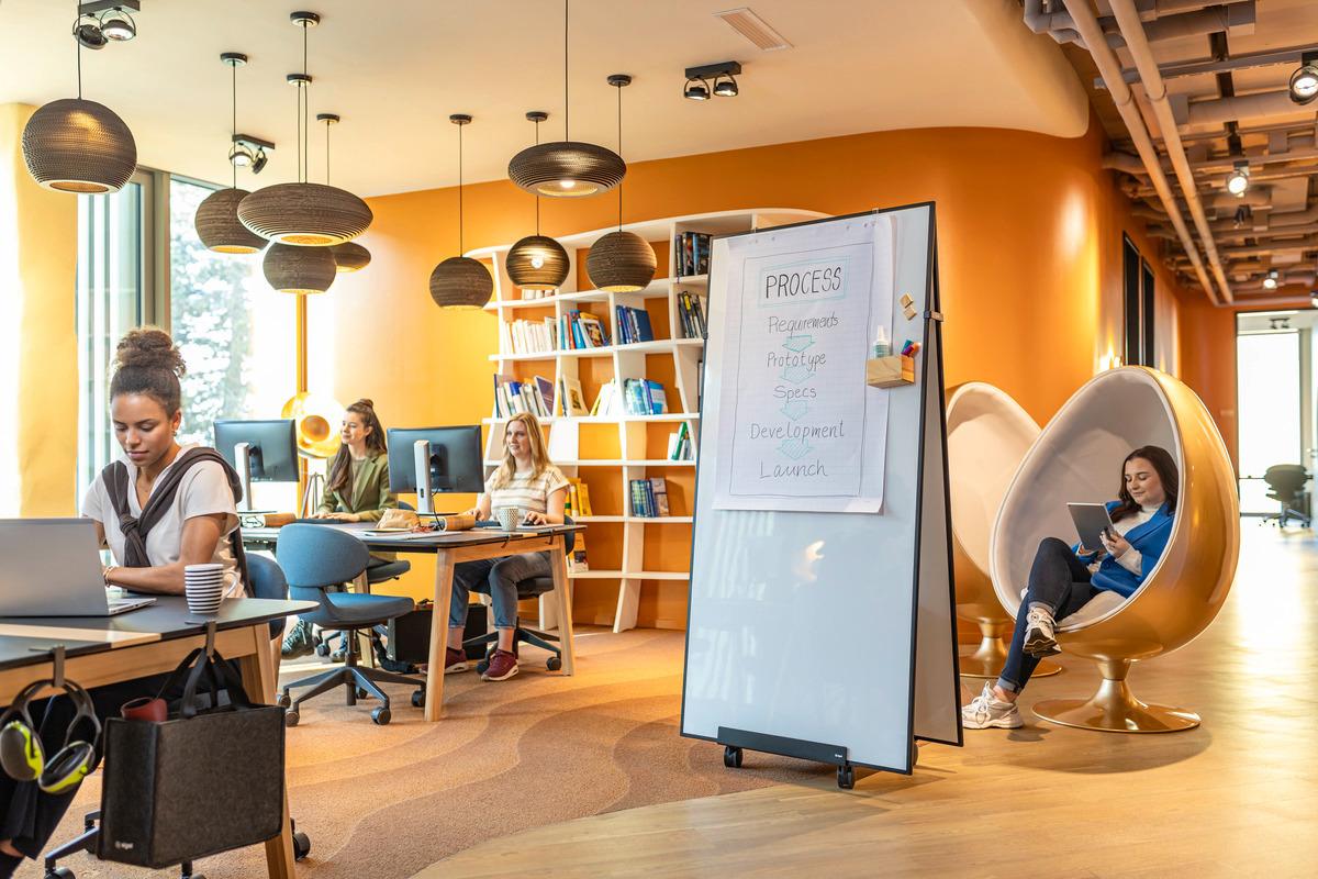 Modern office with work desks and a cozy seating area