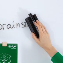 Hand wipes writing from blackboard Green clipboard underneath