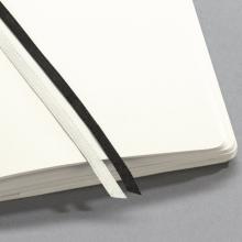 Open book with white pages and two bookmarks, one black and one white