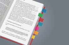 Open book with colorful markings